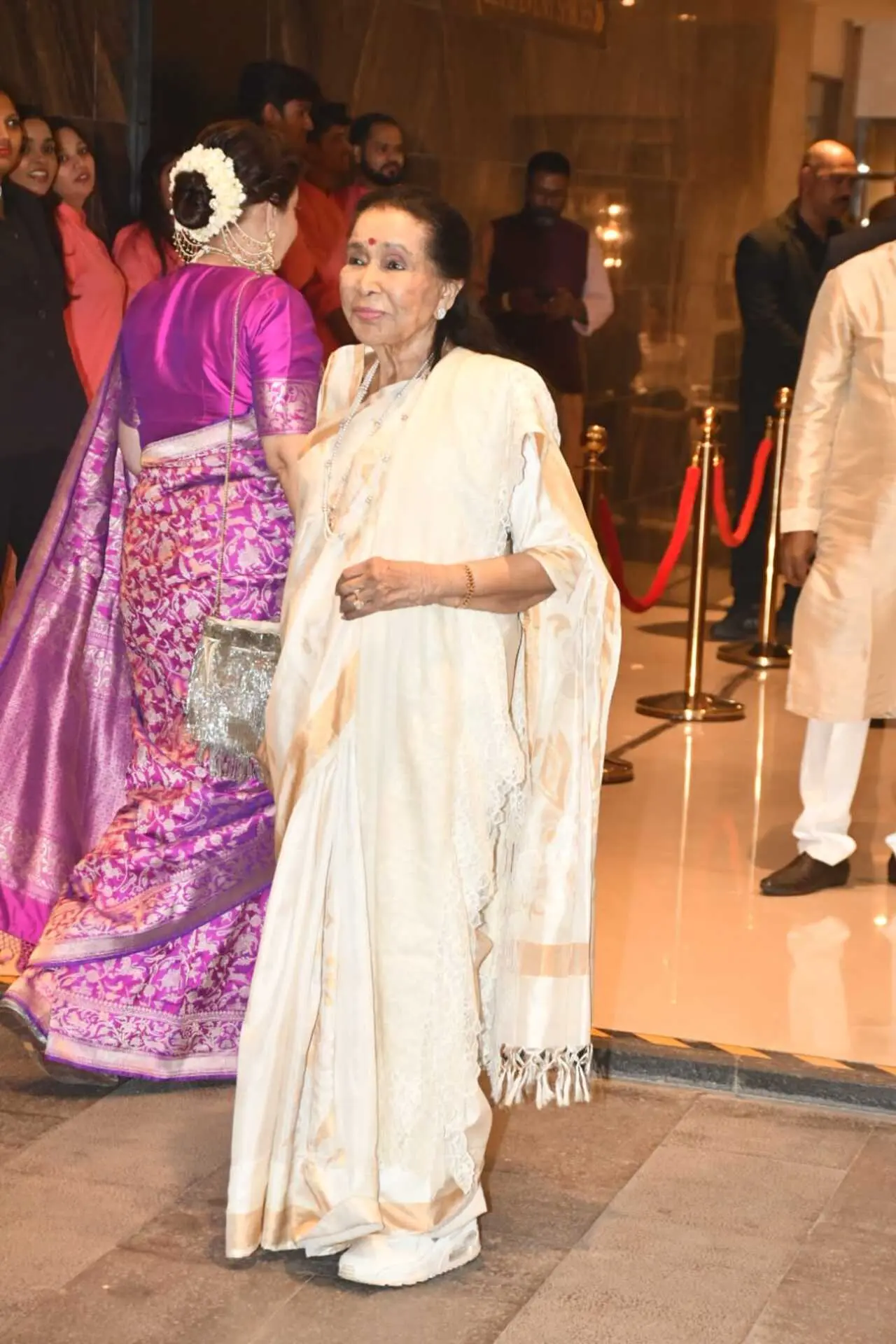 Veteran singer Asha Bhosle was also seen marking her presence to bless the couple.